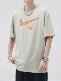 Стильная бежевая удлинённая футболка Nike с широкой проймой