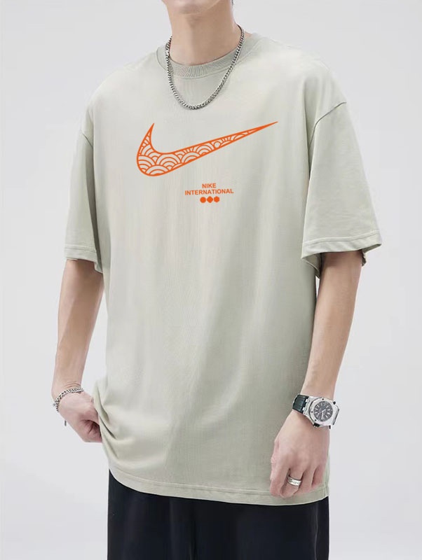 Стильная бежевая удлинённая футболка Nike с широкой проймой