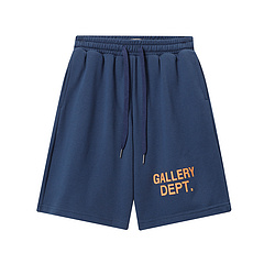 Синие шорты от бренда GALLERY DEPT с оранжевой надписью