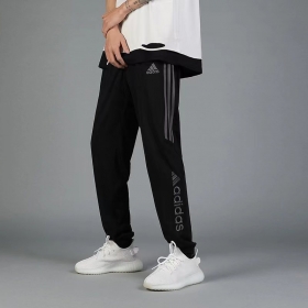 Спортивки из 100% таслана от бренда Adidas чёрные на резинке