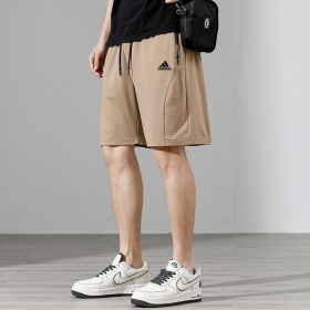 Бежевые прямые шорты Adidas с сетчатыми вставками по бокам 